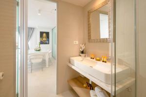 a bathroom with a white sink and a mirror at Beautiful Hvar Villa 4 Bedrooms Villa Hvar Majestic Resort Centre Location & Wonderful Sea Views in Hvar +32 photos