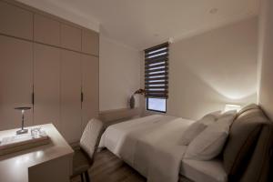 Rúm í herbergi á Hoang Dung Hotel and Apartment by THC Group