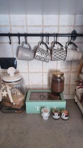 a kitchen with a stove and some pots and pans at A casa di Alessia in Santa Maria delle Mole