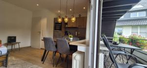 a kitchen and dining room with a table and chairs at Renatas Ferienwohnung Maria in Sasbachwalden