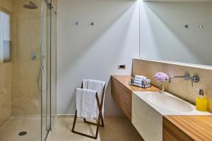 a bathroom with a sink and a shower at Il Leccio - Luxury Resort Portofino Monte in Santa Margherita Ligure