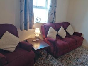 Predel za sedenje v nastanitvi Fairgreen Cottages