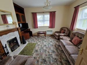 Predel za sedenje v nastanitvi Fairgreen Cottages