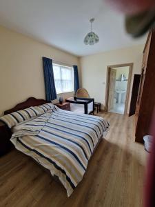 Postelja oz. postelje v sobi nastanitve Fairgreen Cottages