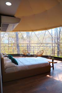 Postel nebo postele na pokoji v ubytování ThauRana Glamping
