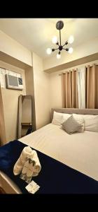 Katil atau katil-katil dalam bilik di Cozy 2bedroom Corner Unit Camella Northpoint Bajada Near Sm Lanang