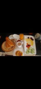a table with plates of food on a table at Villa au centre ville Rabat in Rabat
