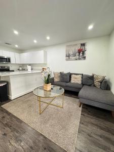 a living room with a couch and a table at 3 STATE FAIR l DT Dallas l FIFA READY l Staycation 1Bd1Ba in Dallas
