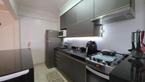 Dapur atau dapur kecil di Aconchego e conforto na praia