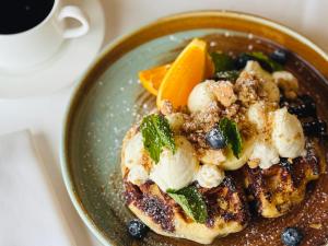 a bowl of food with fruit and ice cream at Chatham Bars Inn in Chatham