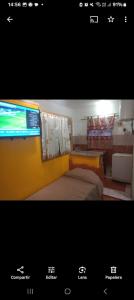 a picture of a room with a bed and a television at Mi Hogar Familiar in Termas de Río Hondo