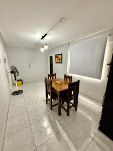 a dining room with a table and chairs at Departamento zona céntrica in San Miguel de Tucumán