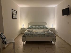 Posteľ alebo postele v izbe v ubytovaní Le Torrette Rooms and Apartments