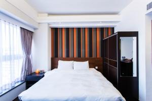 Giường trong phòng chung tại Le Prabelle Hotel