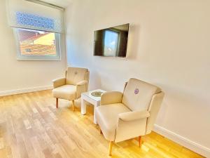 Uma televisão e/ou sistema de entretenimento em Steiner Residences Mödling