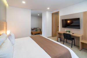 Postel nebo postele na pokoji v ubytování Hotel San Martin Popayan
