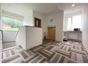 an empty office room with a large white cabinet in it at Hotel Hanafuji Inn - Vacation STAY 60993v in Nakafurano
