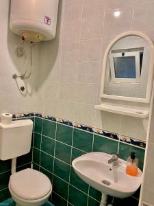 Koupelna v ubytování Apartments Lobby