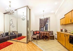 a kitchen and a living room with a table at Best location Old Town Choise in Vilnius