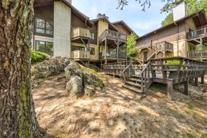 an exterior view of a large house with balconies at Rivers Edge - #402 in Helen