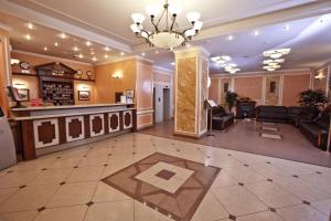 a lobby with a waiting room and a salon at AMAKS Premier Hotel in Perm