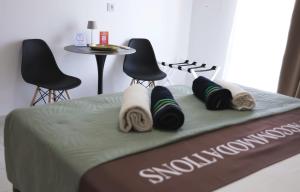 a close up of a bed with towels on it at Apartment Simply 205 in Gázion +60 photos