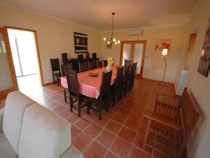 a dining room with a table and chairs at Beautifully Restored Ponte De Lima Farm House 6 Bedrooms Quinta Fornelos Private Pool & Surrounded By Hectares Of Vineyards in Ponte de Lima