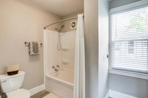 a bathroom with a shower and a toilet at 1 Mi to Water and Dtwn Lake Erie Family Getaway in Sandusky +16 photos
