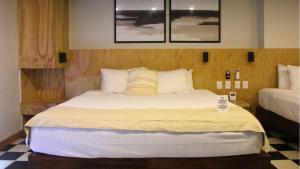 Postel nebo postele na pokoji v ubytování Joint Boutique Hotel