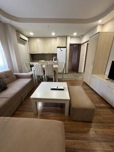 a living room with a couch and a table at Villa Harmony in Ohrid
