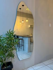 a kitchen with a mirror on the wall at Rodrigues AP Apartamento em Barreirinhas in Barreirinhas