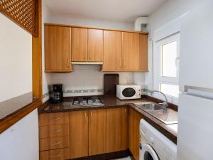 A kitchen or kitchenette at Lovely Apartment near Seabeach