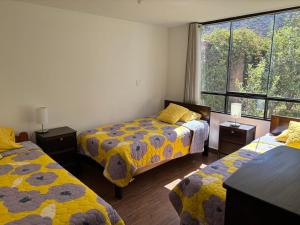 Ένα ή περισσότερα κρεβάτια σε δωμάτιο στο Valle Sagrado Urubamba +22 φωτογραφίες