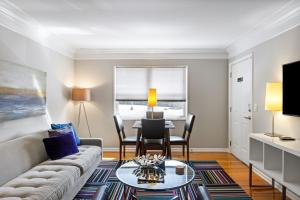 a living room with a couch and a table at Brookwood Courtyard by BCA Furnished Apartments in Atlanta