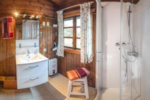 a bathroom with a sink and a shower at Bergcottage in Neerdar +25 photos