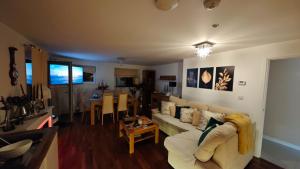 a living room with a couch and a table at The Bridge in Dartford