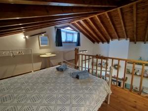 a bedroom with a bed with two towels on it at dilemi 3 in Tavari