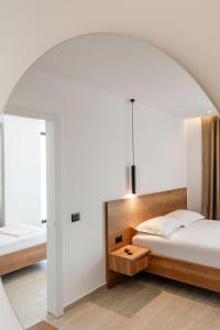 Postel nebo postele na pokoji v ubytování Hotel EN AD