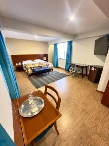 Postel nebo postele na pokoji v ubytování Hotel Esencia Suites