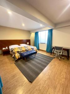 Postel nebo postele na pokoji v ubytování Hotel Esencia Suites