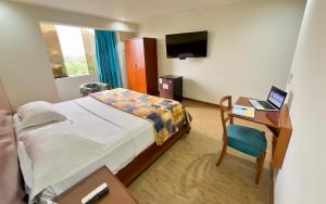 TV a/nebo společenská místnost v ubytování Hotel Esencia Suites