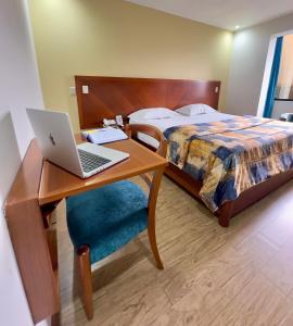 Postel nebo postele na pokoji v ubytování Hotel Esencia Suites