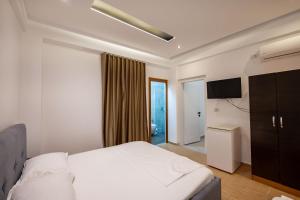 Postel nebo postele na pokoji v ubytování Hotel EN AD