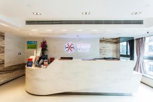 Giường trong phòng chung tại Le Prabelle Hotel