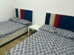 Giường trong phòng chung tại residence la fontaine