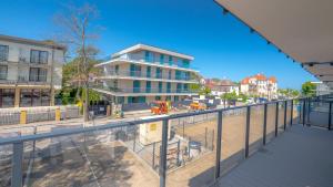 a view of a building from a balcony at Rezydencja Niechorze D210 z 2 sypialniami Eco Boho - 5D Apartments in Niechorze