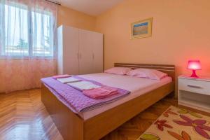 Posteľ alebo postele v izbe v ubytovaní Apartment in Crikvenica 5611