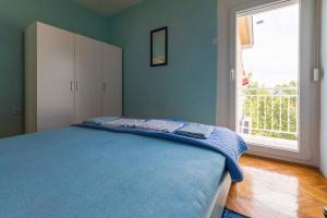 Posteľ alebo postele v izbe v ubytovaní Apartment in Crikvenica 5611