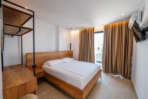 Postel nebo postele na pokoji v ubytování Hotel EN AD