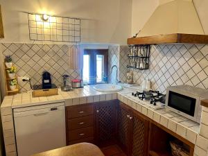 Kuchyň nebo kuchyňský kout v ubytování La Casa Ocra Suite